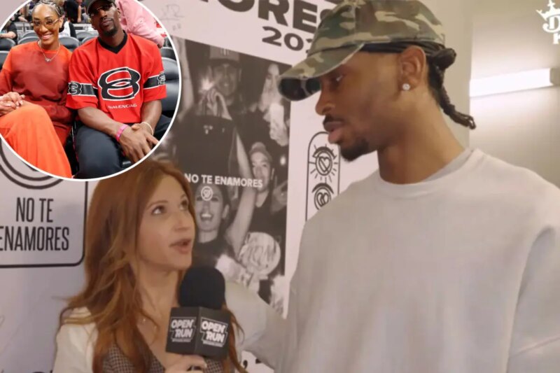 A’ja Wilson #22 dari Las Vegas Aces berbicara dengan pacarnya Bam Adebayo dari Miami Heat sebelum Kontes 3 Poin WNBA STARRY selama akhir pekan AT&T WNBA All-Star 2025 di Gainbridge Fieldhouse pada 18 Juli 2025 di Indianapolis, Indiana.   <span class=